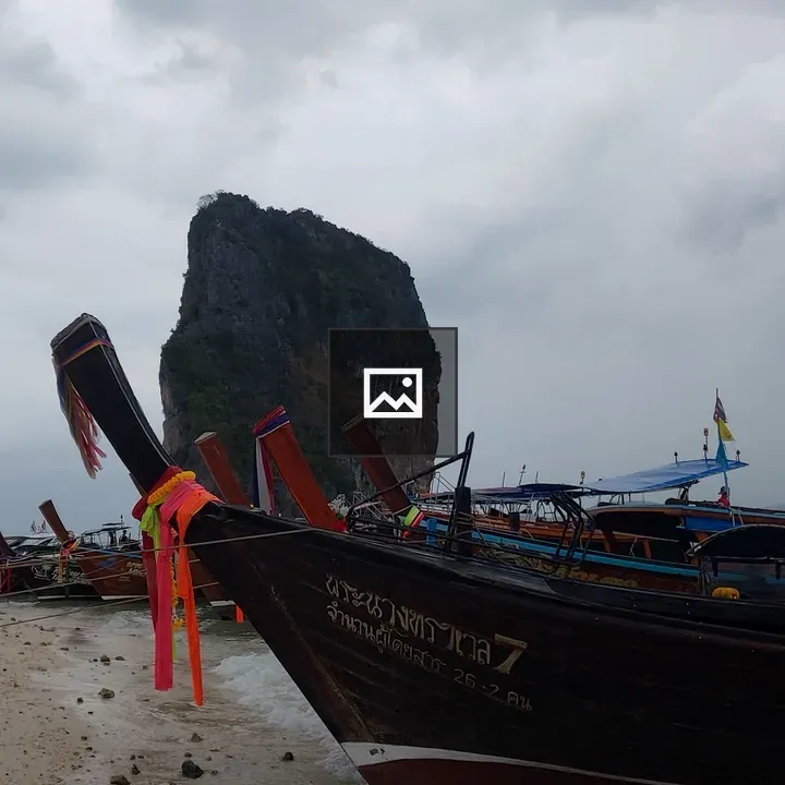 Long tailed boats on the water
