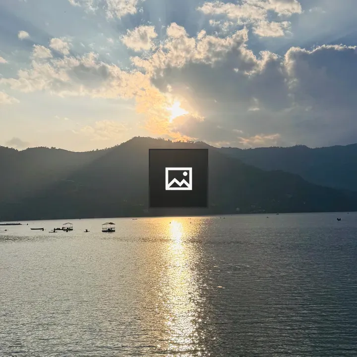 Sunset Over Pokhara Lake with Boats