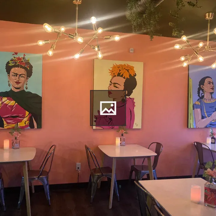 Cozy cafe interior with pink walls