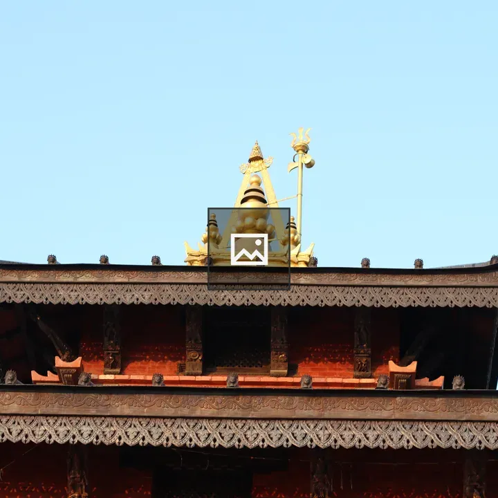 Intricate roof with golden pinnacle