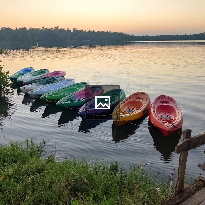 Row of Colorful Canoes on Lake