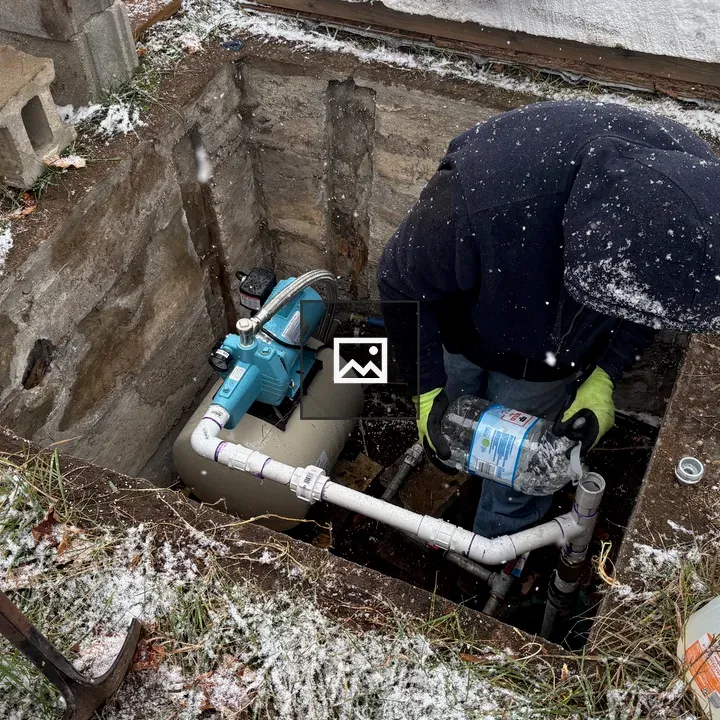 Hole with water pump and pipes