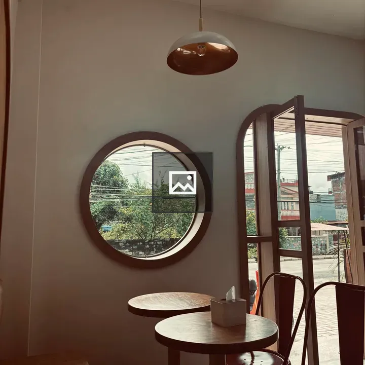 Cozy Café Interior with Round Window