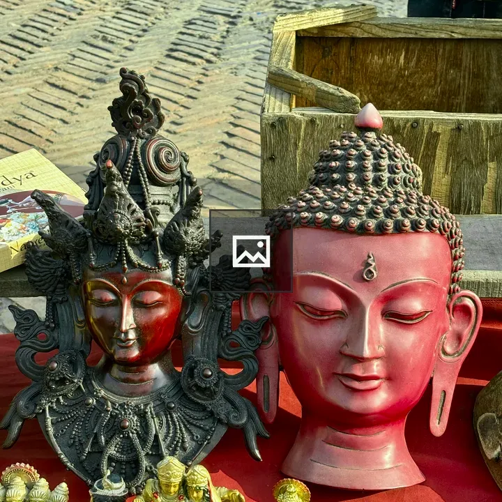 Two ornate sculptures display,