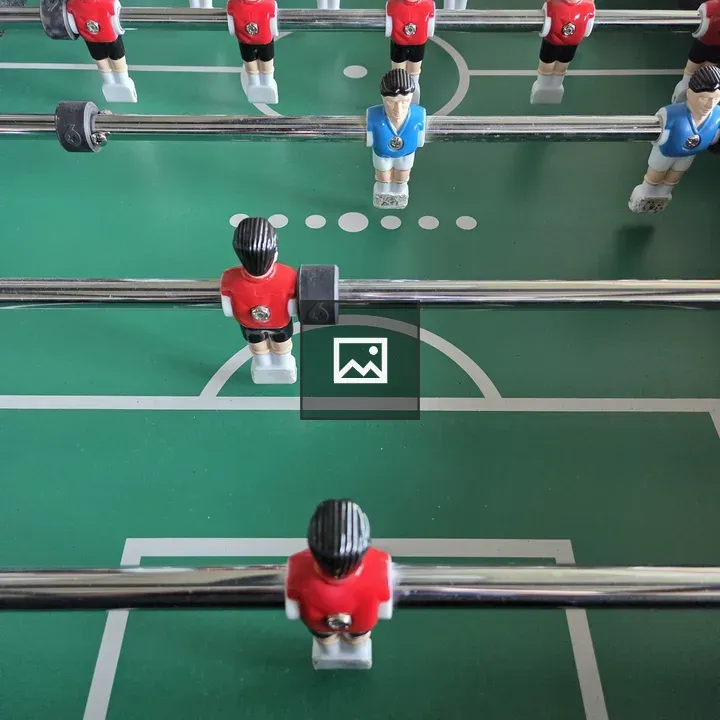 Foosball Table with Red and Blue Players