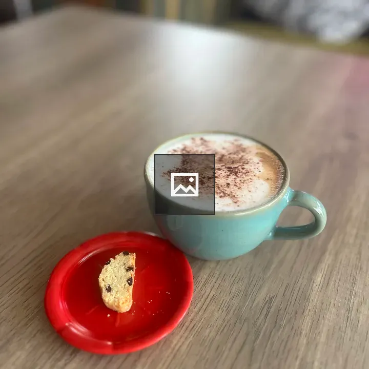 Cappuccino in Blue Mug with Cookie