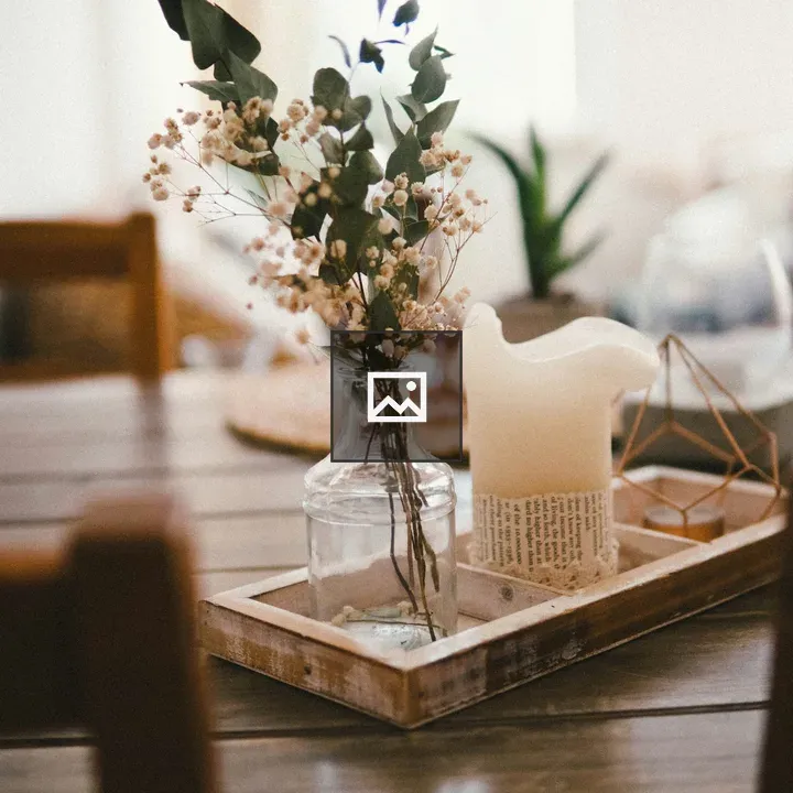 Flowers with a Candle on Dining Table