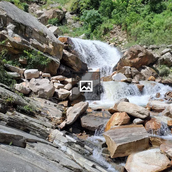 Cascading Waterfall Over Rocks