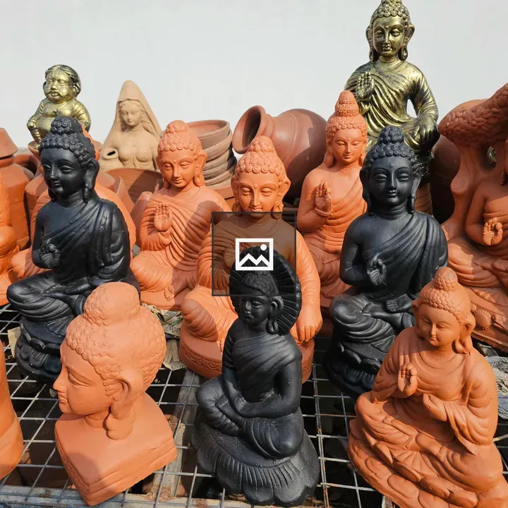 Clay Buddha statues on street in Kozhikode