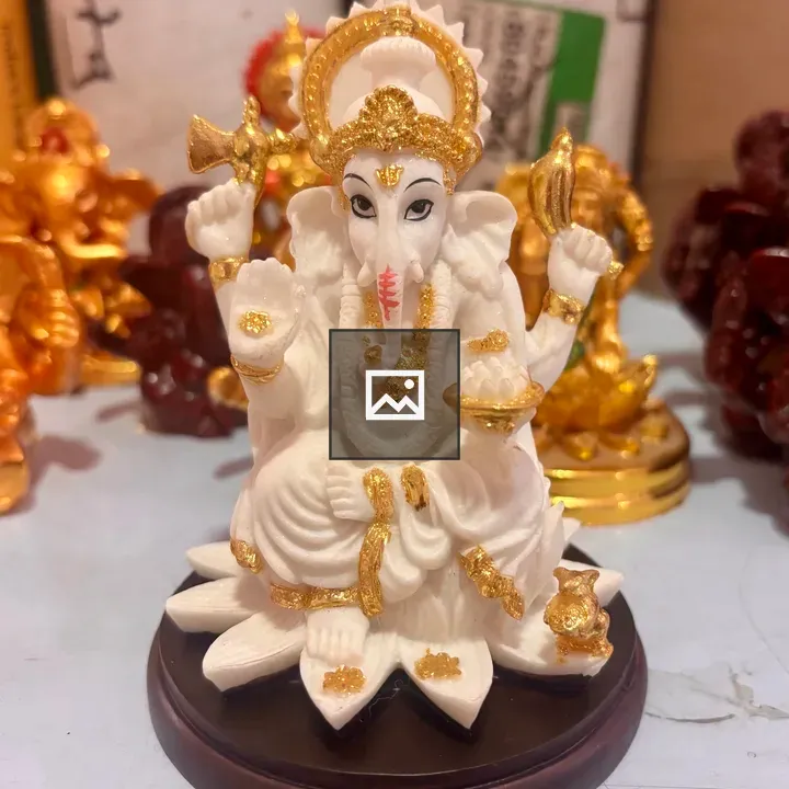 White Ganesh statue on lotus base