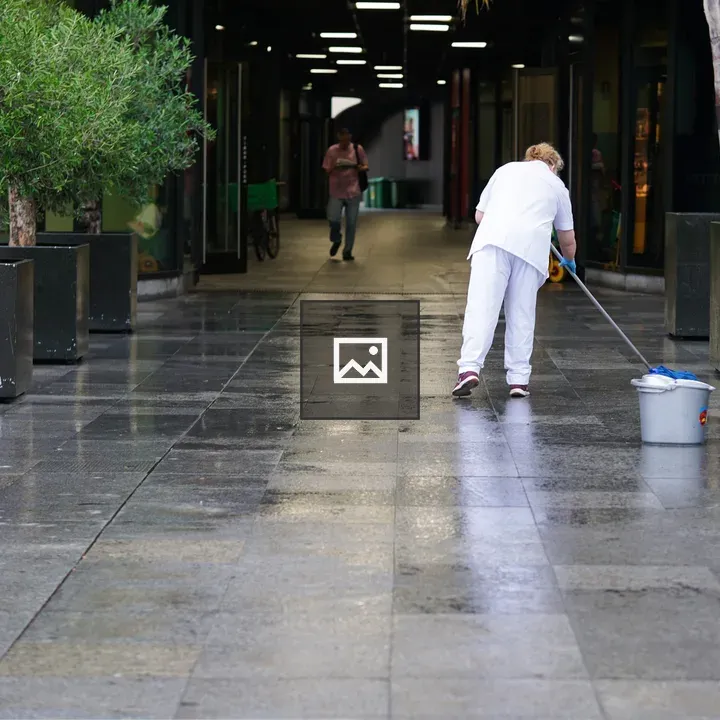 Person mopping in corridor
