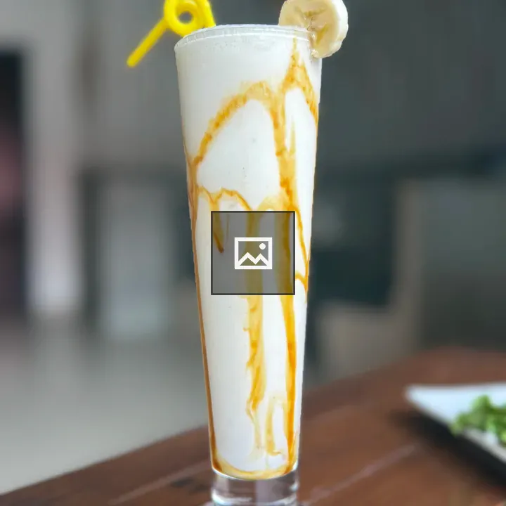 Tall glass banana smoothie