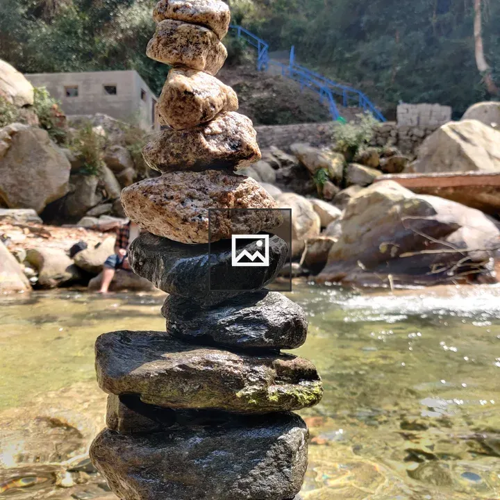 Rock cairn by water