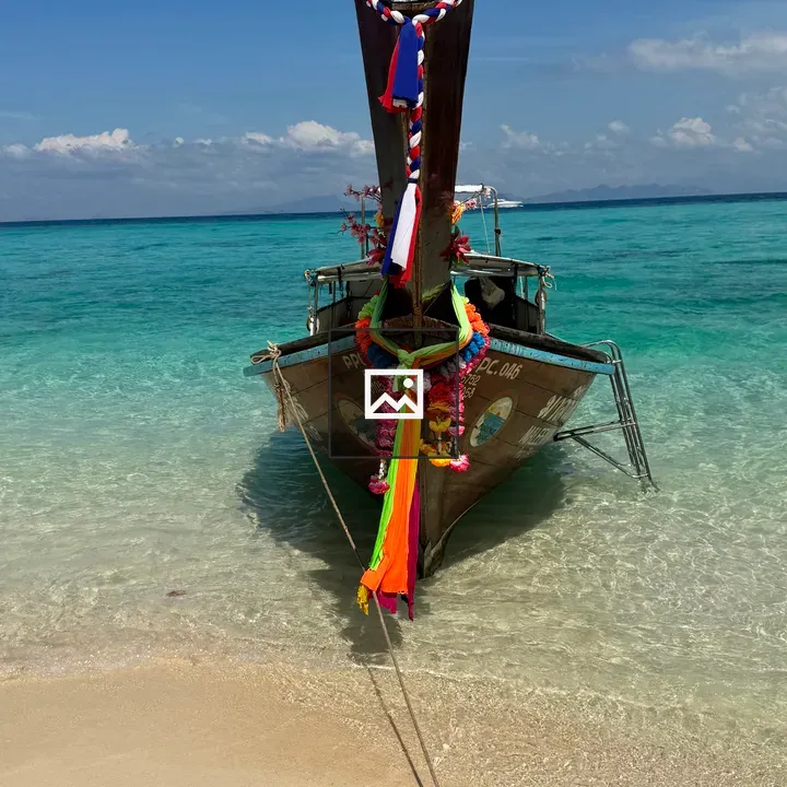 Wooden longtail boat at beach
