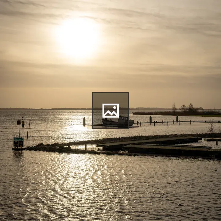 Sunset over Lauwersmeer water
