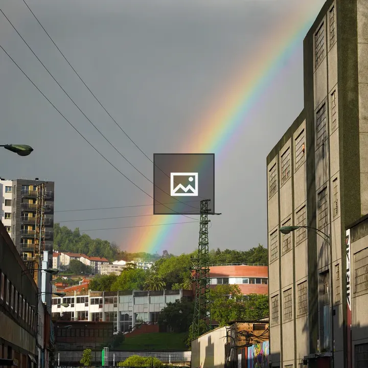 Rainbow Over Industrial Landscape
