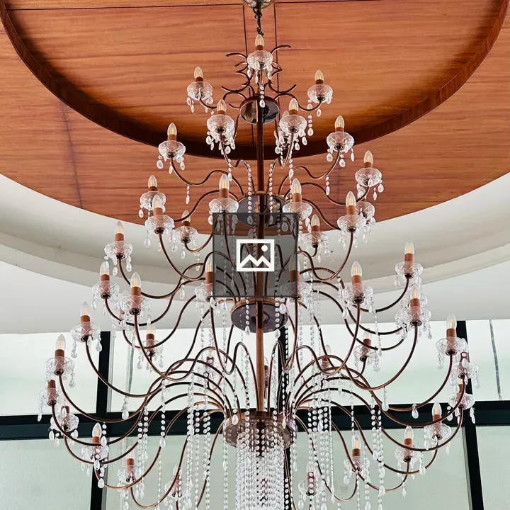 Chandelier over Wooden ceiling