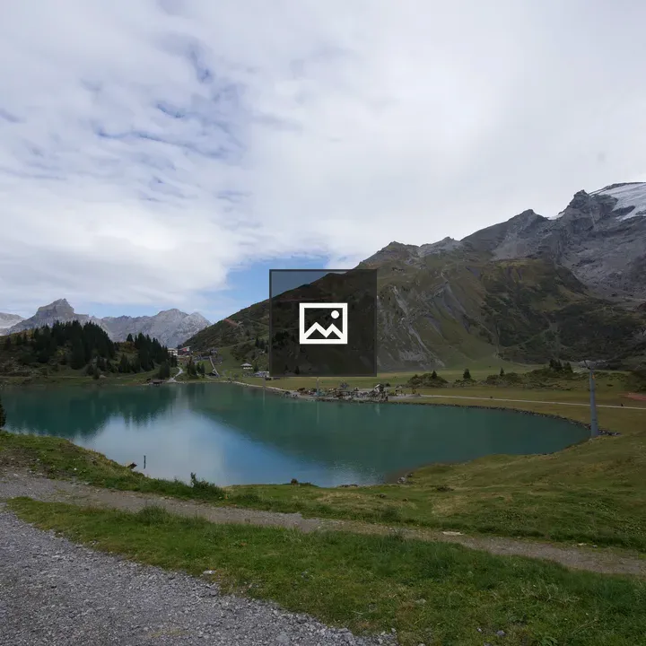 Alpine Lake with Snowy Peaks