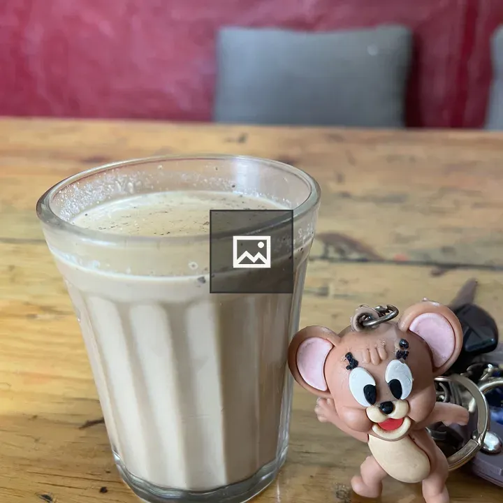 Glass of chai on table