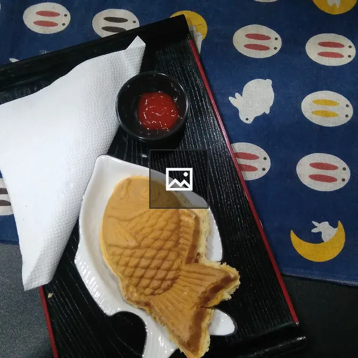 Fish Cake on Black Tray
