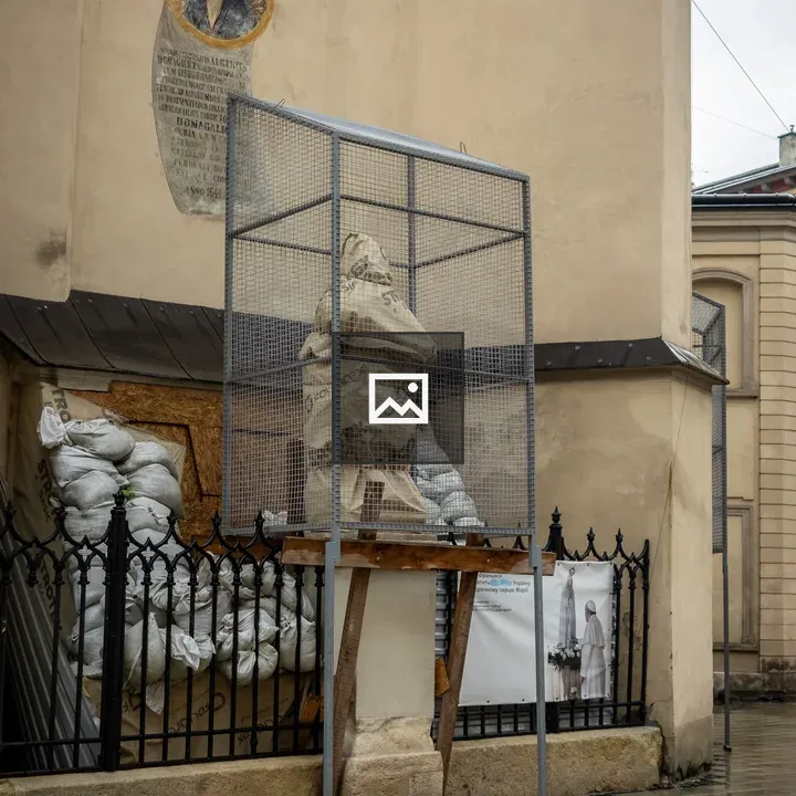 Protective cage around church statue
