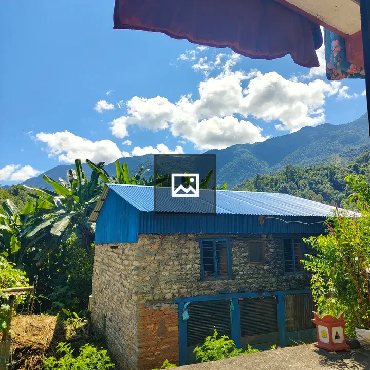 Rustic stone house with blue roof