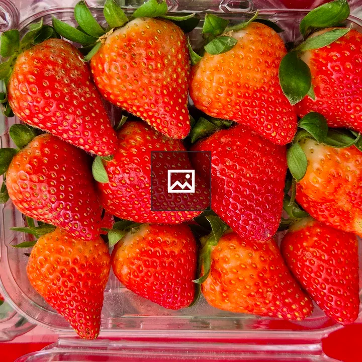 Ripe strawberries in container