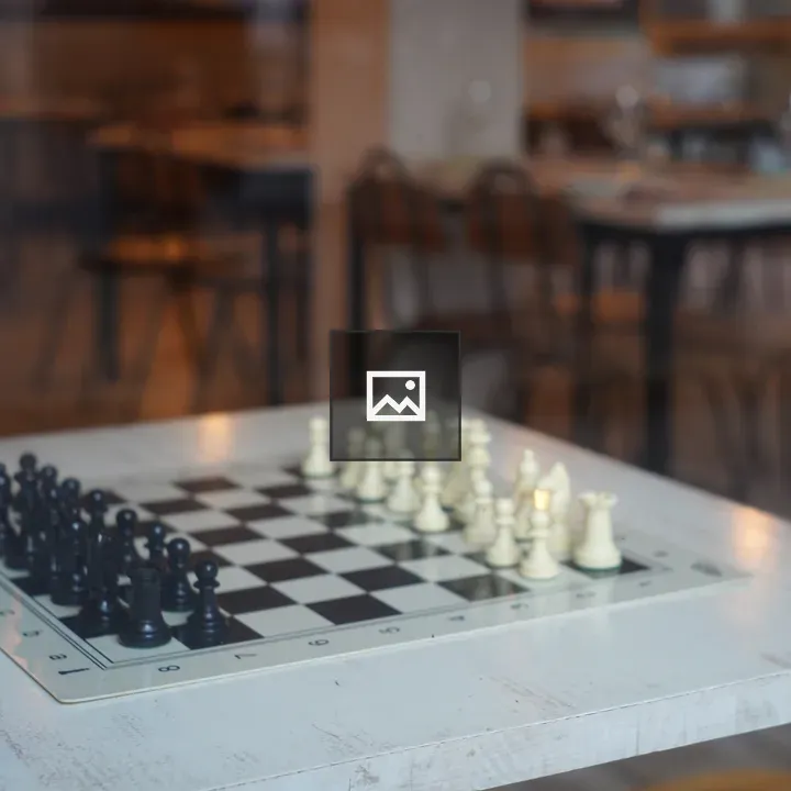 Chess board on wooden cafe table