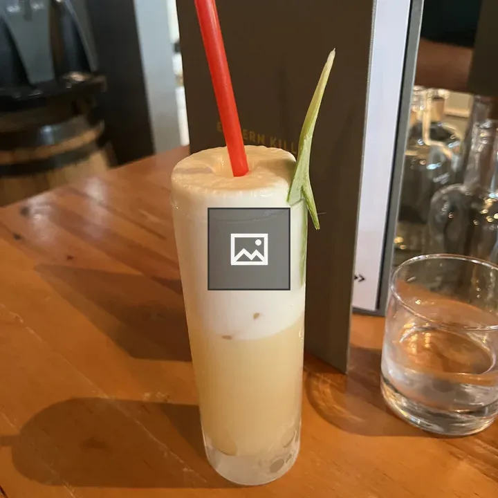 Tall slender cocktail with foam