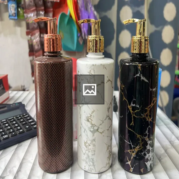 Three decorative pump bottles