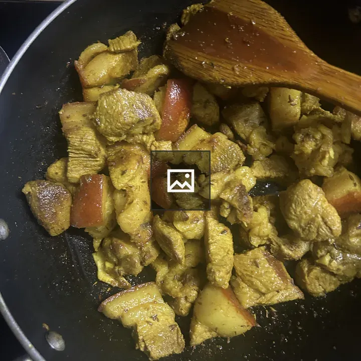Pork pieces in a frying pan