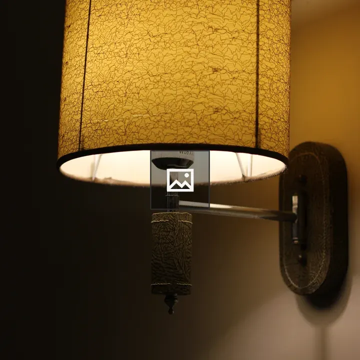 Wall-mounted lamp with yellow lampshade