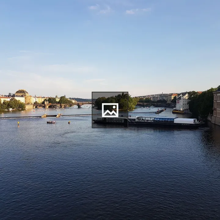 River scene with boats and bridge