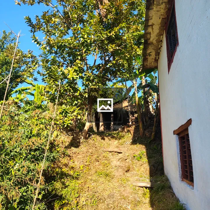 Pathway on Green hillside with house