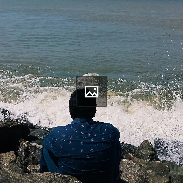 Man on rocks at the beach