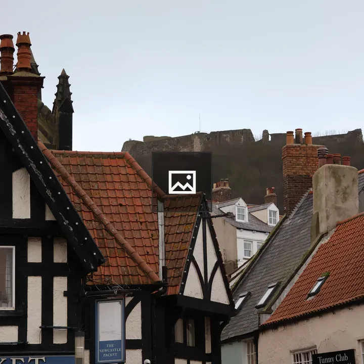 Old buildings and Scarborough Castle ramparts