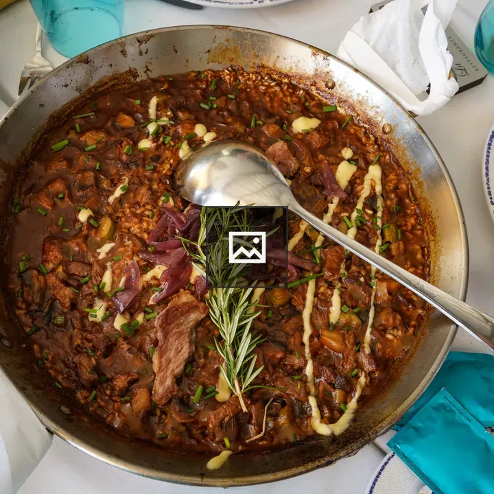 Meat and rice stew in pan