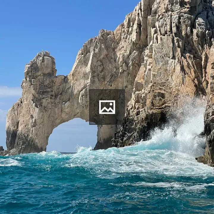 Coastal rock arch in turquoise waters