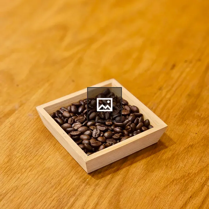 Coffee beans on wooden tray