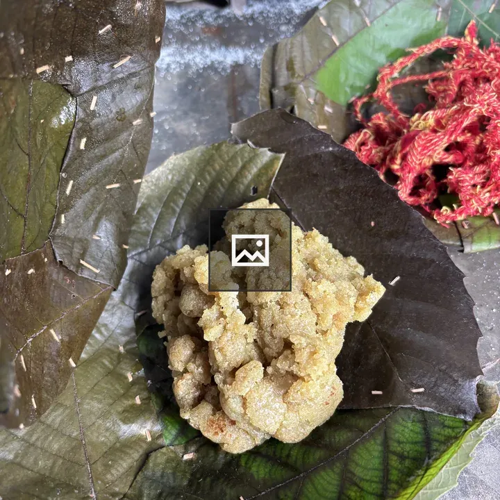 Cluster of yellowish-brown foods on leaves