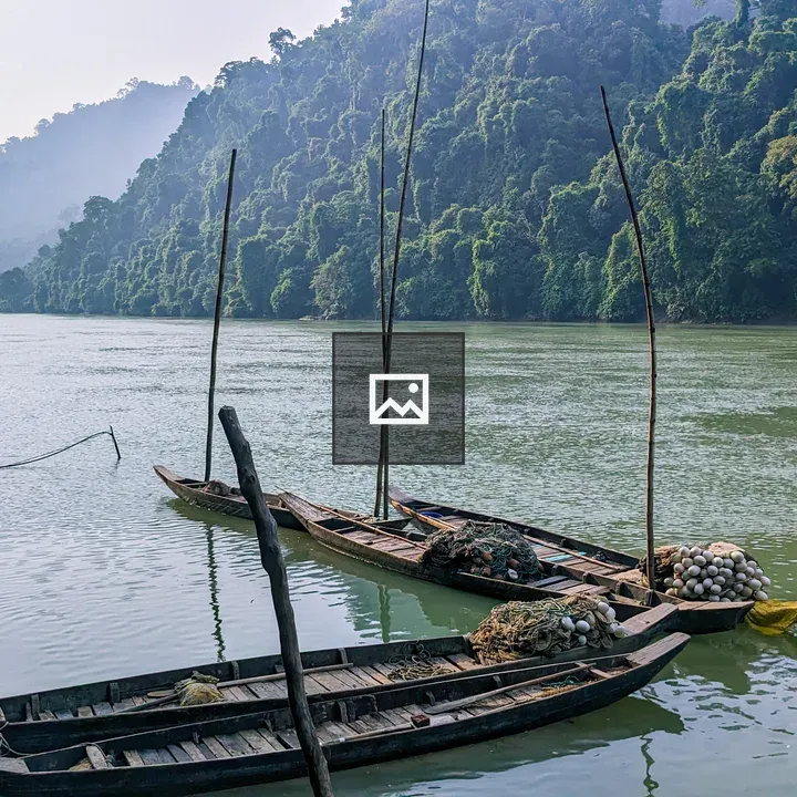 Wooden boats on riverbank
