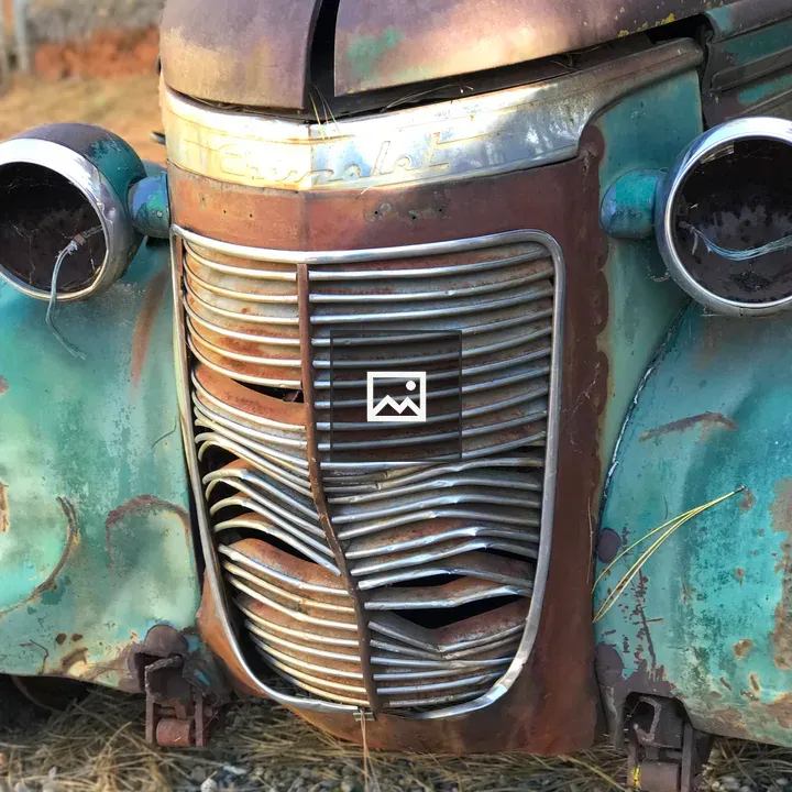 Front Of A Rusted Vehicle