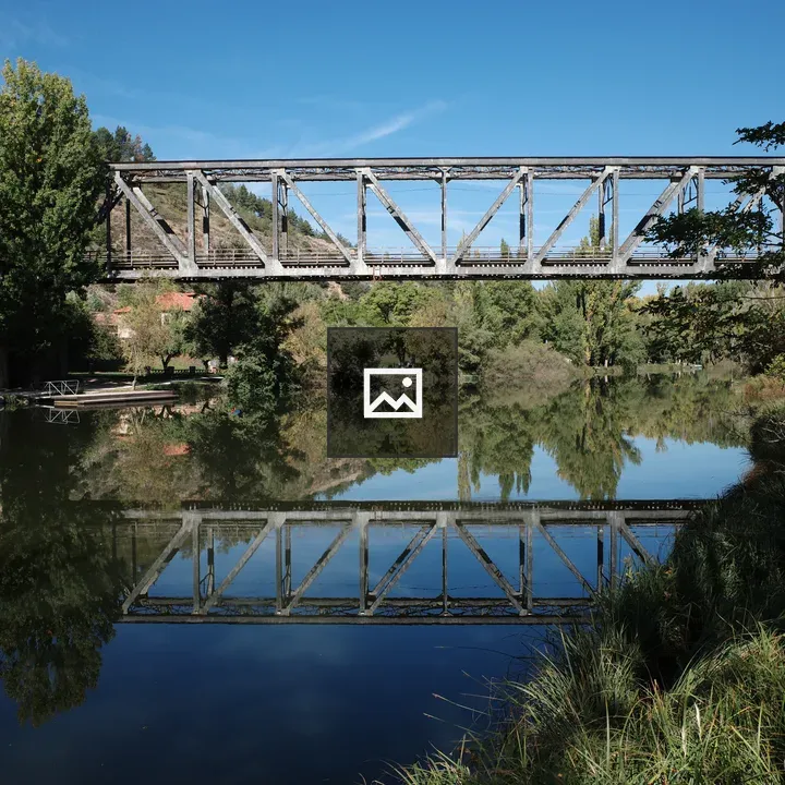 Metal train bridge over Duero river