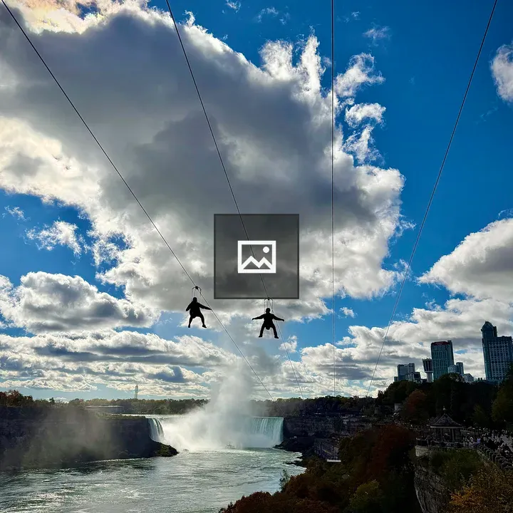 Two zipliners above Niagara Falls