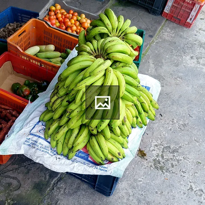 Bananas on blue crate in open-air market