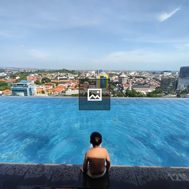 Person at Edge of Infinity Pool