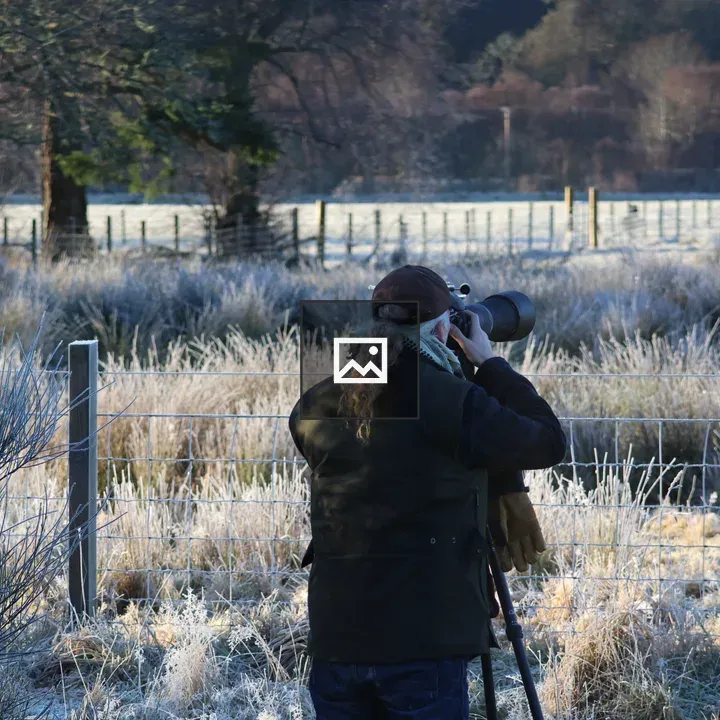 Photographer at work on frosty morning