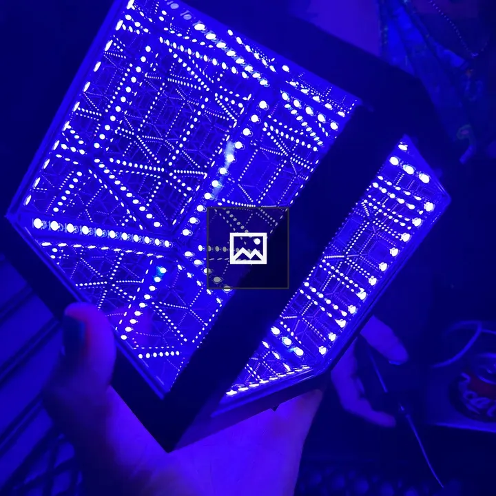 Illuminated hypercube in hand