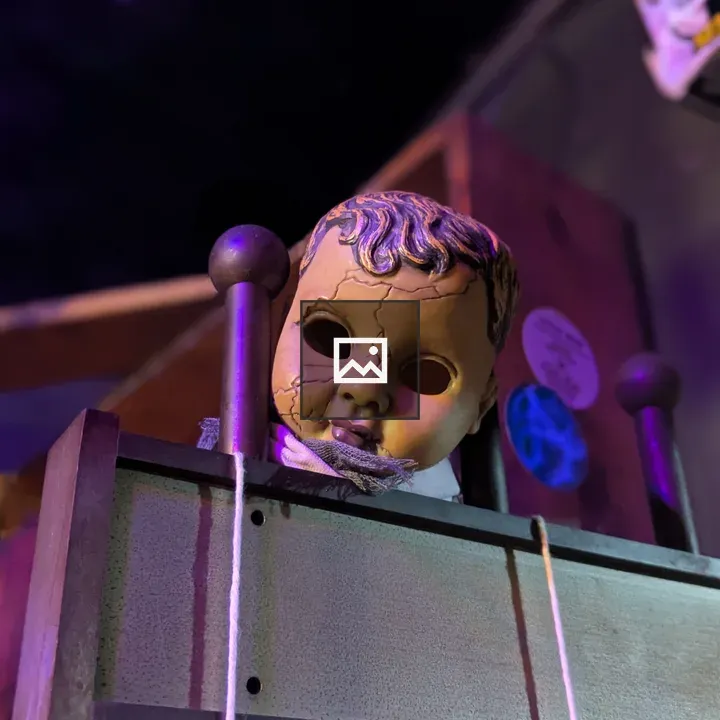 Creepy doll head on gate