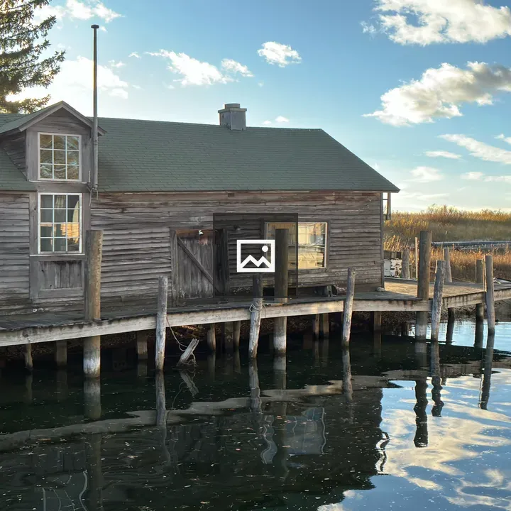 Fishing hut by river in Leelanau